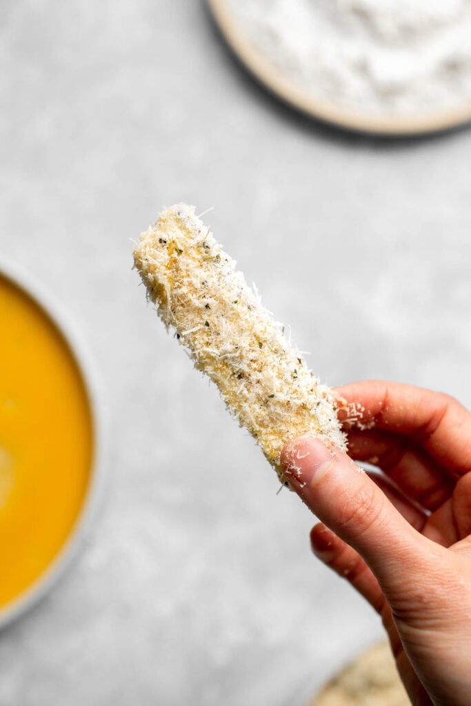 Baked Zucchini Fries are healthy, flavorful, and delicious. This summer vegetable is crispy on the outside while soft and creamy on the inside. | aheadofthyme.com