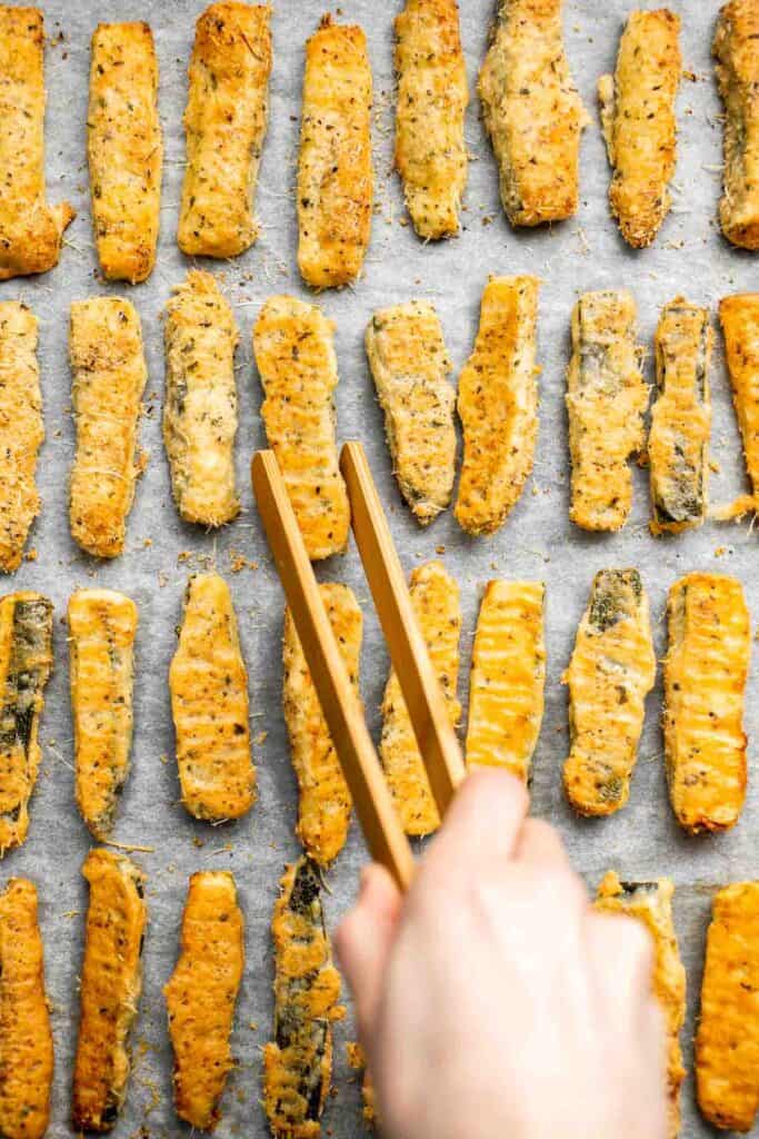 Baked Zucchini Fries are healthy, flavorful, and delicious. This summer vegetable is crispy on the outside while soft and creamy on the inside. | aheadofthyme.com