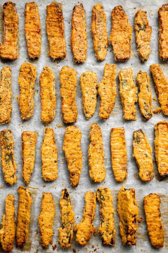 Baked Zucchini Fries are healthy, flavorful, and delicious. This summer vegetable is crispy on the outside while soft and creamy on the inside. | aheadofthyme.com