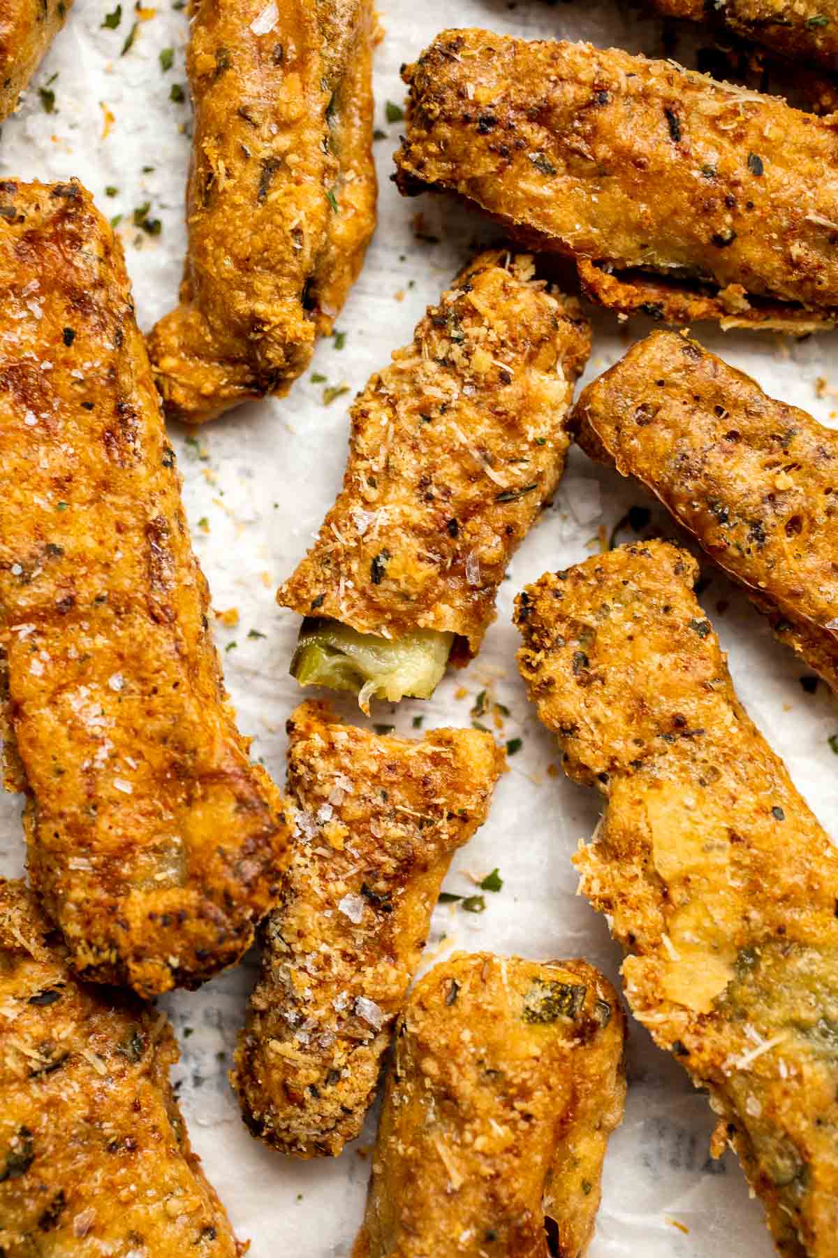 Baked Zucchini Fries are healthy, flavorful, and delicious. This summer vegetable is crispy on the outside while soft and creamy on the inside. | aheadofthyme.com