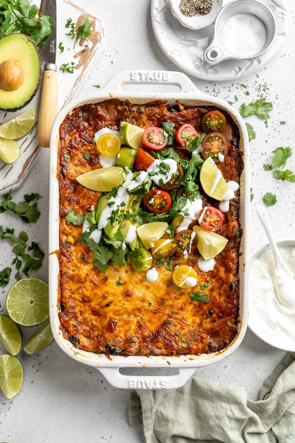 Chicken Enchilada Casserole is cheesy, saucy, and packed with layers of enchilada classics like chicken and beans, tortillas, and cheese. A family favorite! | aheadofthyme.com