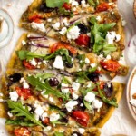 Mediterranean Flatbread is a zesty and cheesy vegetarian pizza, loaded with classic Mediterranean ingredients. It is quick and easy to make in 20 minutes. | aheadofthyme.com