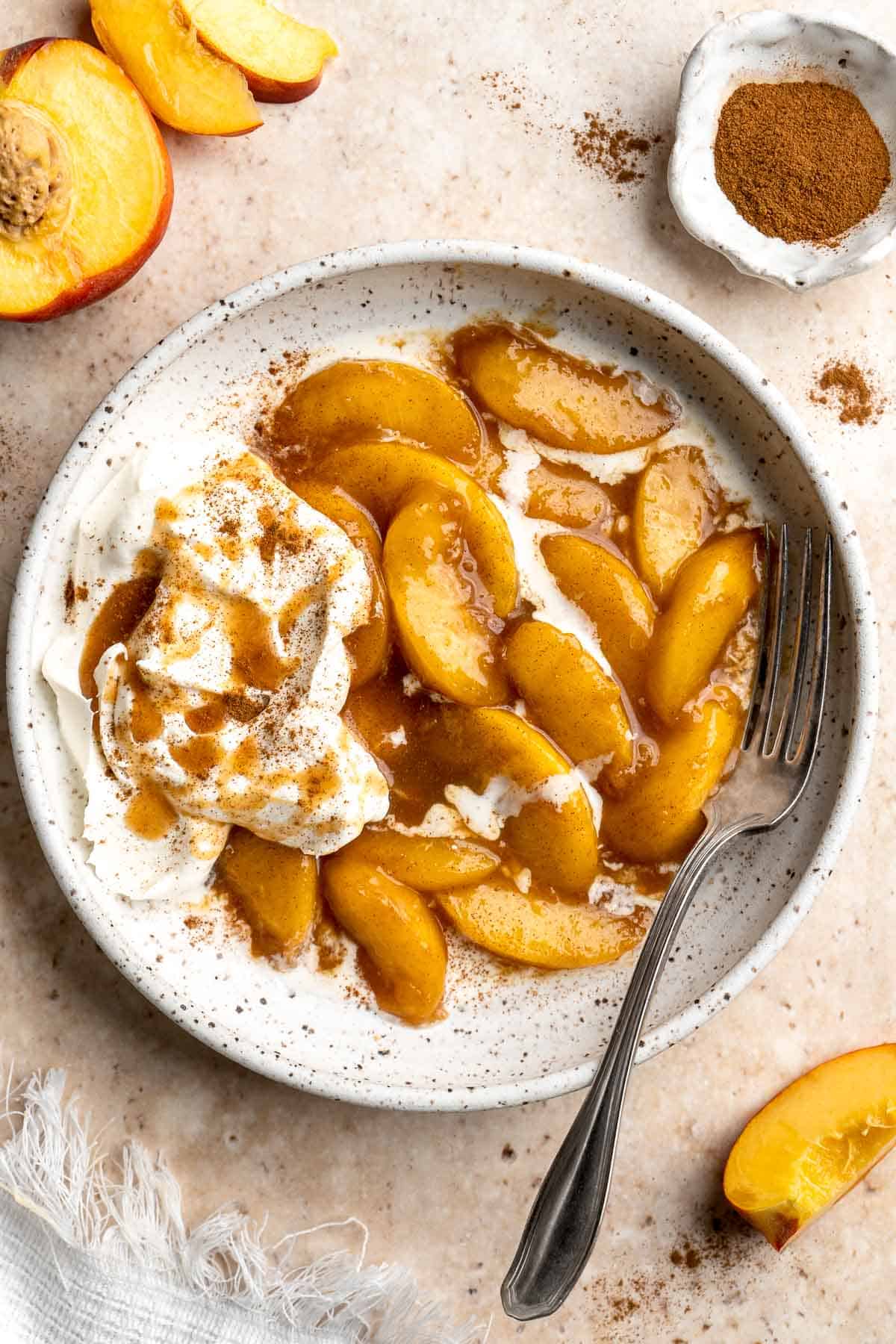 Peaches and Cream is an old-fashioned, no bake dessert that is simple to make with layers of tender, stewed peaches and homemade whipped cream. | aheadofthyme.com