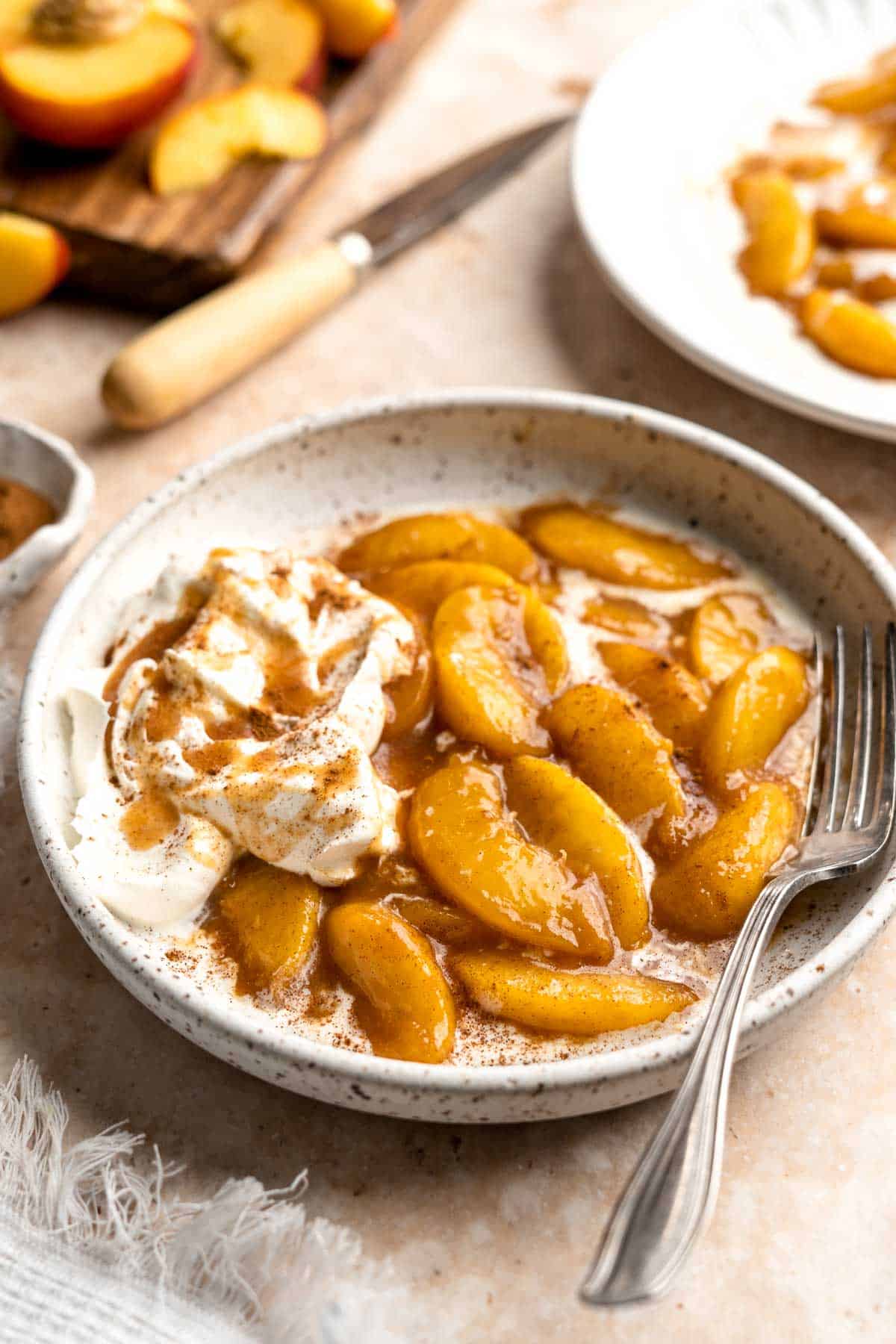 Peaches and Cream is an old-fashioned, no bake dessert that is simple to make with layers of tender, stewed peaches and homemade whipped cream. | aheadofthyme.com