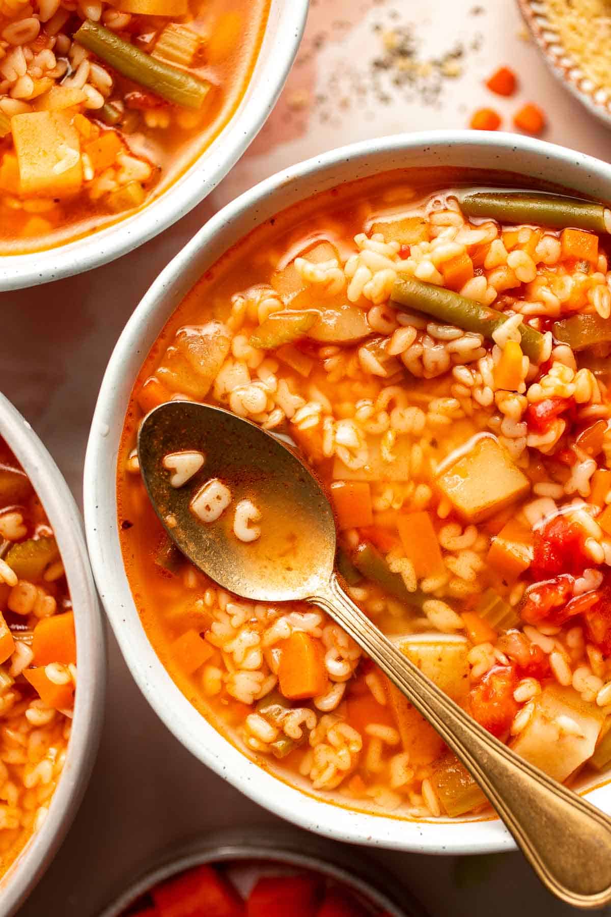 Homemade Alphabet Soup will quickly become a family favorite with its hearty vegetables and fun alphabet noodles. It's quick and easy to make in 30 minutes. | aheadofthyme.com