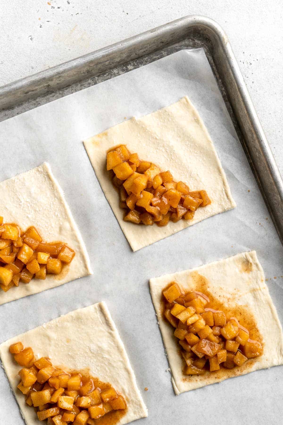 With a buttery, flaky crust and spiced sweet apple filling, these homemade Apple Turnovers are hands down one of the best ways to enjoy this seasonal fruit. | aheadofthyme.com