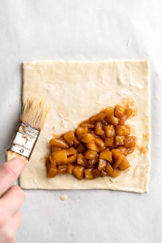 With a buttery, flaky crust and spiced sweet apple filling, these homemade Apple Turnovers are hands down one of the best ways to enjoy this seasonal fruit. | aheadofthyme.com