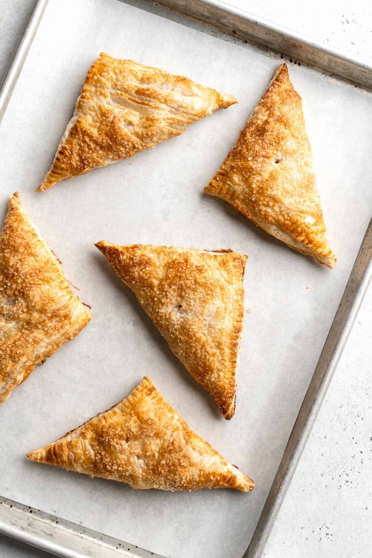 With a buttery, flaky crust and spiced sweet apple filling, these homemade Apple Turnovers are hands down one of the best ways to enjoy this seasonal fruit. | aheadofthyme.com