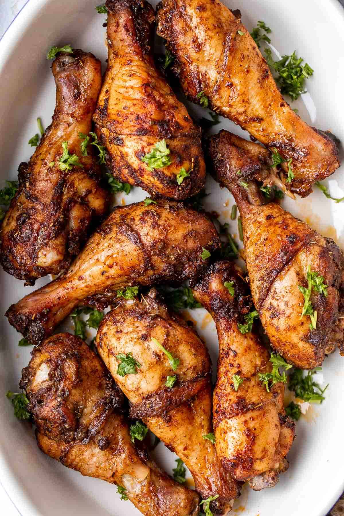 Baked Chicken Drumsticks are ideal for busy weeknights. Marinate inexpensive chicken legs with everyday spices and bake until crispy, tender, and flavorful. | aheadofthyme.com