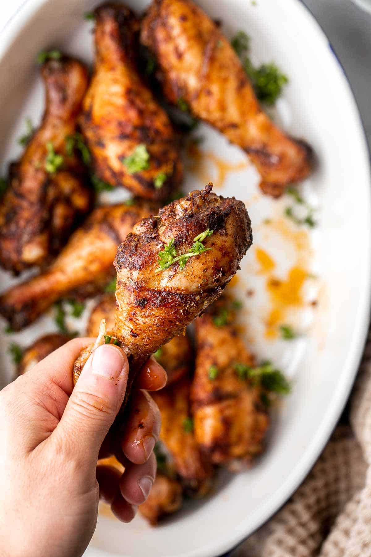 Baked Chicken Drumsticks are ideal for busy weeknights. Marinate inexpensive chicken legs with everyday spices and bake until crispy, tender, and flavorful. | aheadofthyme.com