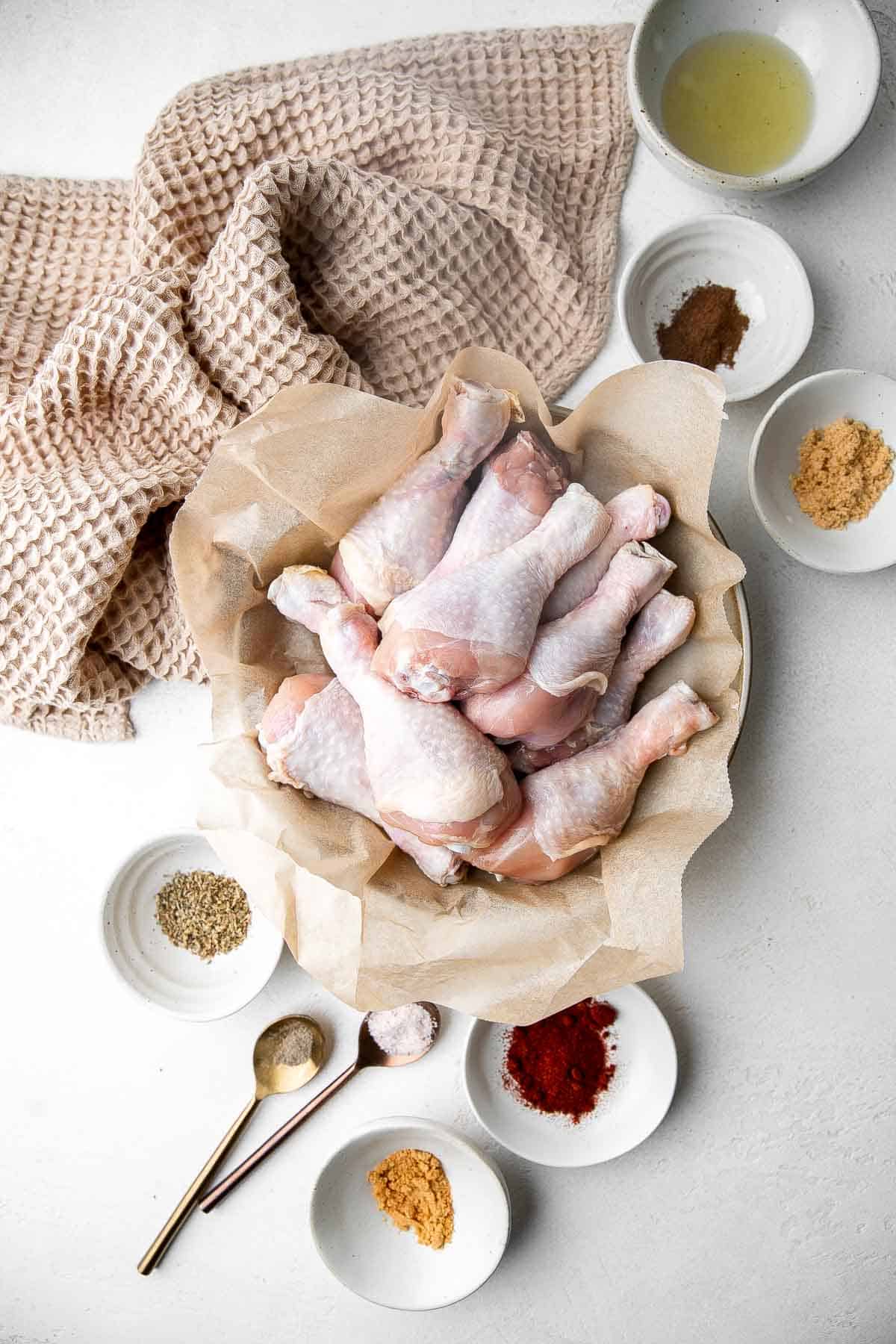 Baked Chicken Drumsticks are ideal for busy weeknights. Marinate inexpensive chicken legs with everyday spices and bake until crispy, tender, and flavorful. | aheadofthyme.com