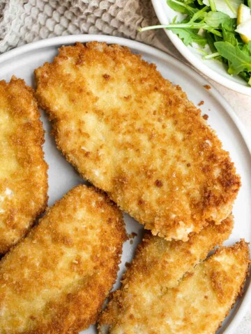 Chicken Milanese is an Italian classic that is crispy, juicy, and easy to make. Lightly breaded chicken cutlets are pan-fried until crispy and golden. | aheadofthyme.com