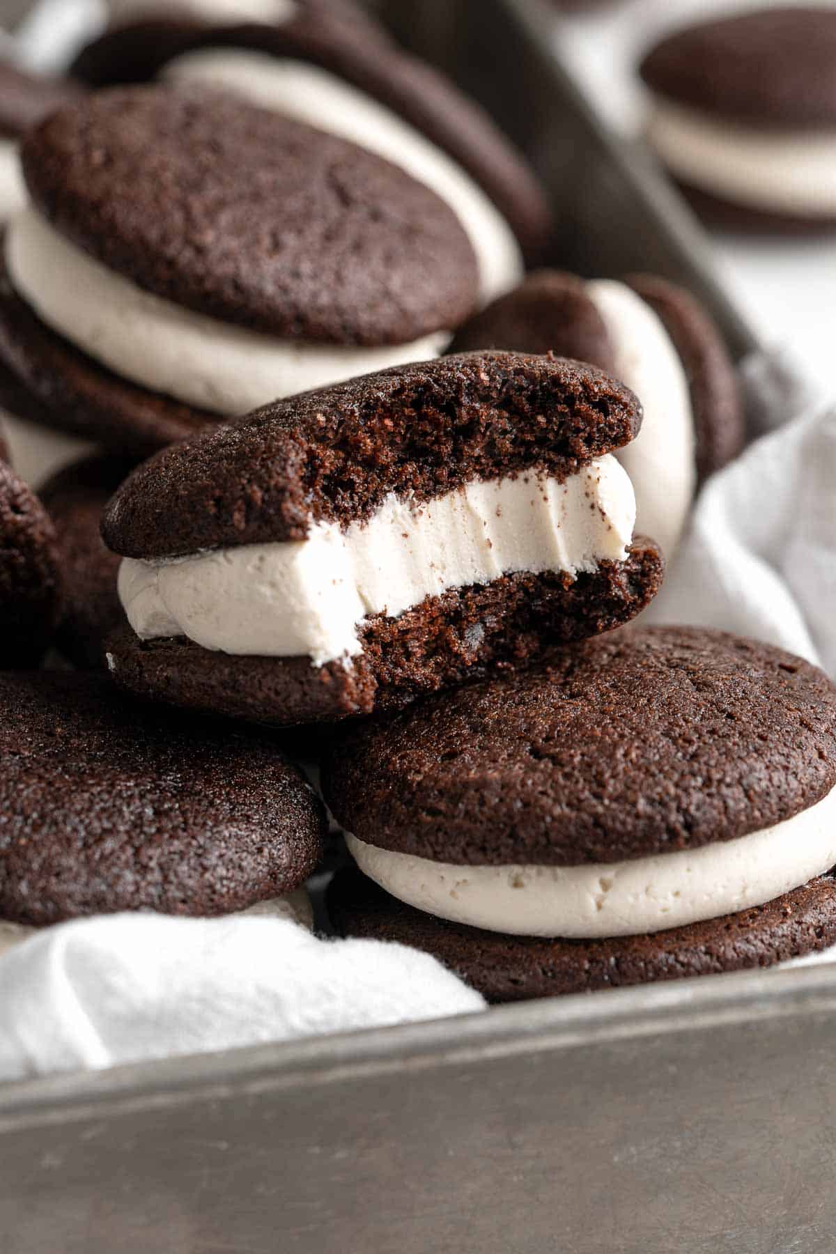 Chocolate Whoopie Pies are a classic American dessert made with two cake-like chocolate cookies sandwiched together with a creamy marshmallow filling. | aheadofthyme.com