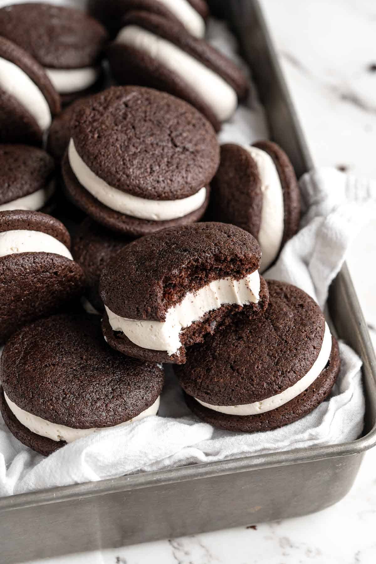 Chocolate Whoopie Pies are a classic American dessert made with two cake-like chocolate cookies sandwiched together with a creamy marshmallow filling. | aheadofthyme.com