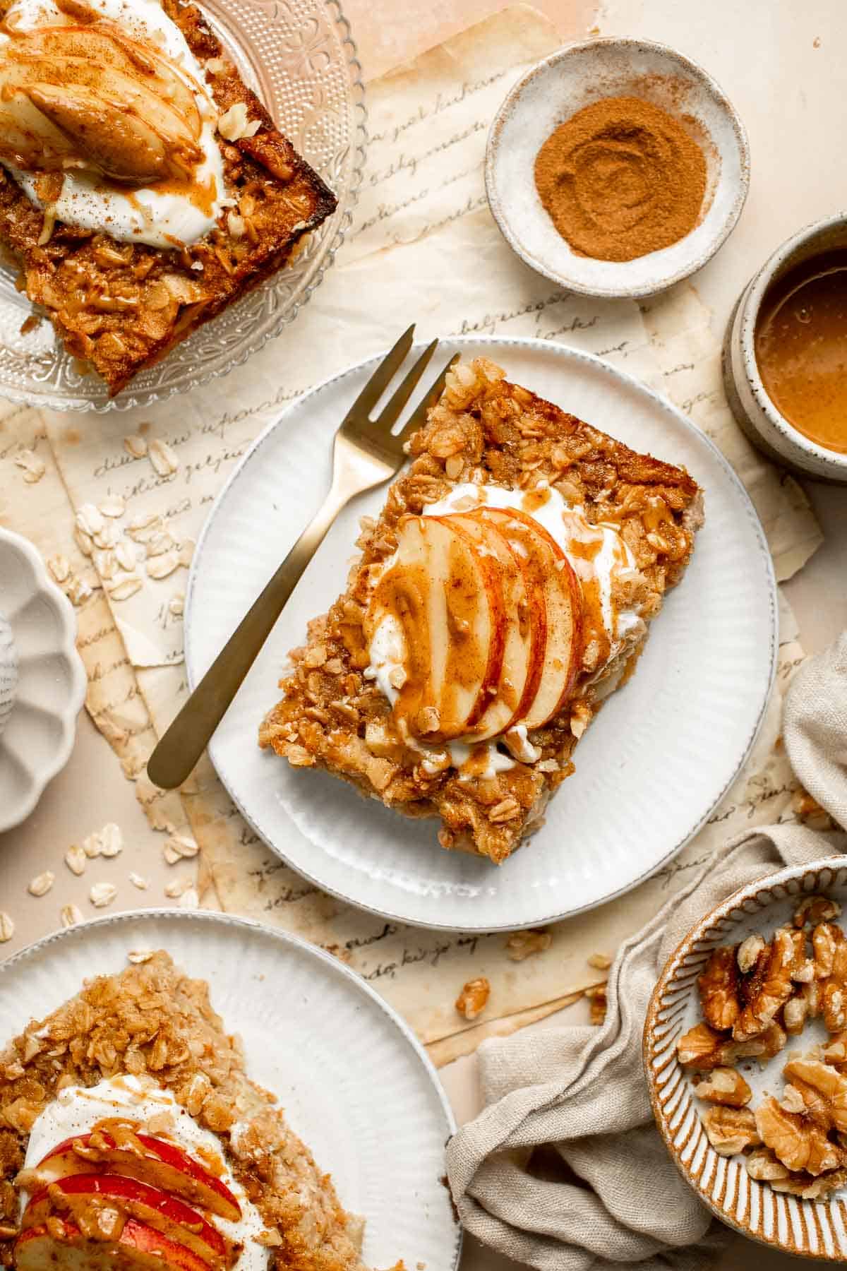 Cinnamon Apple Baked Oatmeal is a delicious, filling make-ahead breakfast for fall — loaded with chewy oats, tender apples, crunchy walnuts, and cinnamon. | aheadofthyme.com
