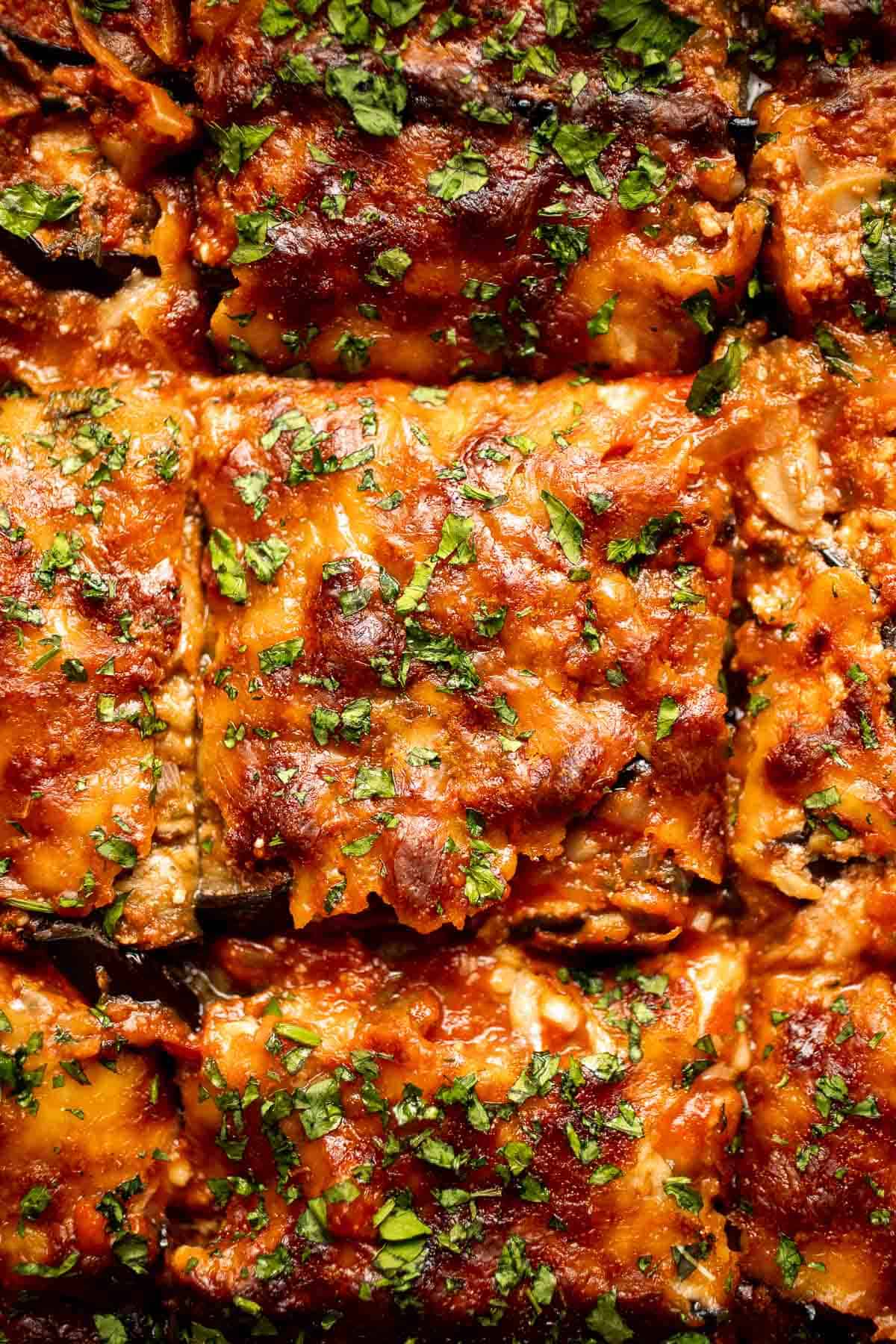 This Eggplant Lasagna is cheesy, saucy, and packed with layers of roasted eggplant, mushrooms, and melty cheese. It's gluten-free and vegetarian too. | aheadofthyme.com