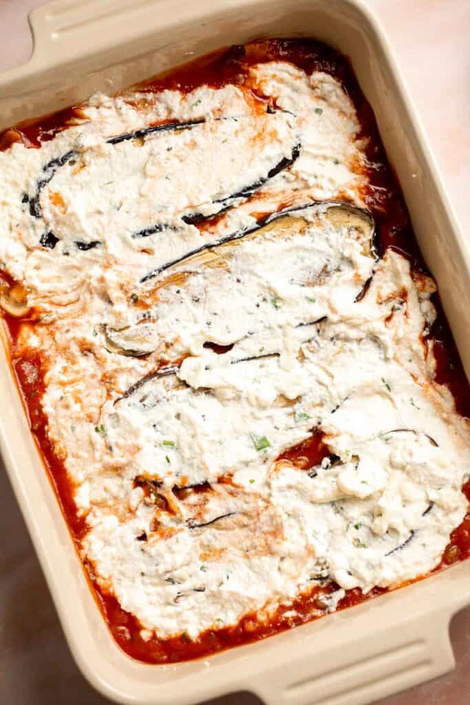 This Eggplant Lasagna is cheesy, saucy, and packed with layers of roasted eggplant, mushrooms, and melty cheese. It's gluten-free and vegetarian too. | aheadofthyme.com