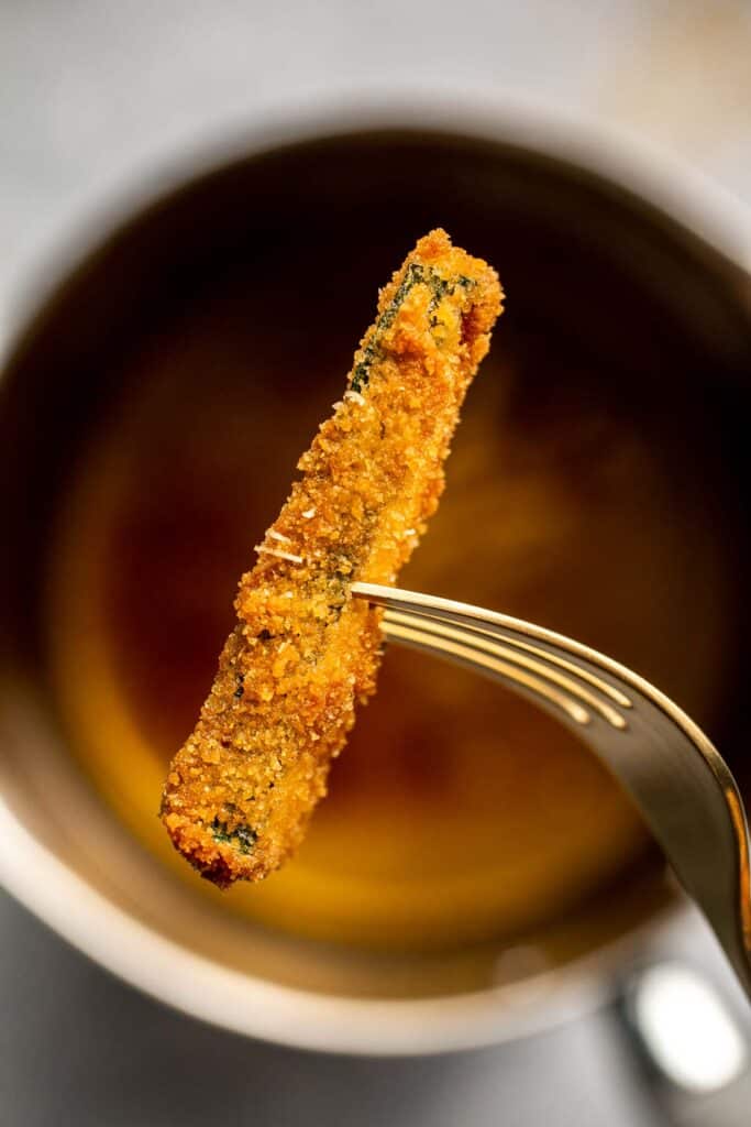 Fried Zucchini are flavorful, savory, and delicious. Soft and tender zucchini fries are coated in a golden crispy breadcrumb exterior. So good! | aheadofthyme.com