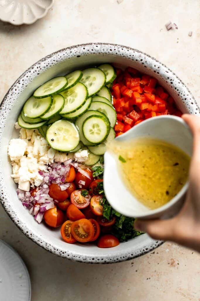 Israeli Couscous Salad is a hearty, flavorful, and delicious salad, packed with pearl couscous, fresh veggies, and feta, tossed in a simple lemon dressing. | aheadofthyme.com