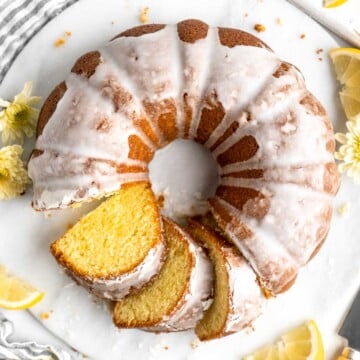 Lemon Bundt Cake with a sweet vanilla glaze is light, fluffy, and moist with a perfect golden brown crumb and made with real lemons. | aheadofthyme.com