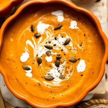 This Pumpkin Soup is perfectly smooth and creamy with aromatic vegetables and warm spices. Make it this fall from start to finish in about 30 minutes! | aheadofthyme.com