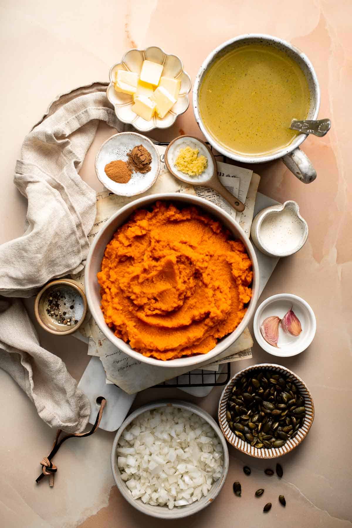This Pumpkin Soup is perfectly smooth and creamy with aromatic vegetables and warm spices. Make it this fall from start to finish in about 30 minutes! | aheadofthyme.com