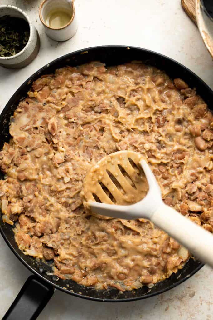 Homemade Refried Beans are simple, easy to make, and taste better than store-bought refried beans by a mile. They are creamy, chunky, and delicious! | aheadofthyme.com