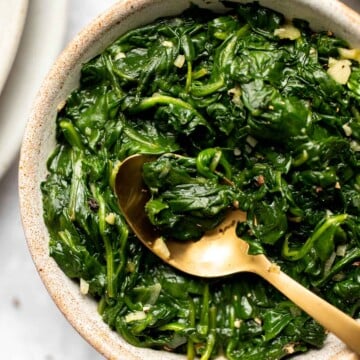 This buttery, garlicky Sautéed Spinach is the best way to enjoy this nutritious green. It's the ultimate healthy side dish and takes a few minutes to make! | aheadofthyme.com