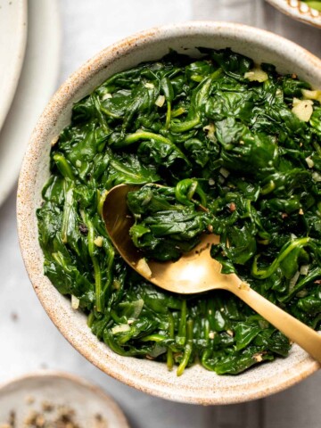 This buttery, garlicky Sautéed Spinach is the best way to enjoy this nutritious green. It's the ultimate healthy side dish and takes a few minutes to make! | aheadofthyme.com