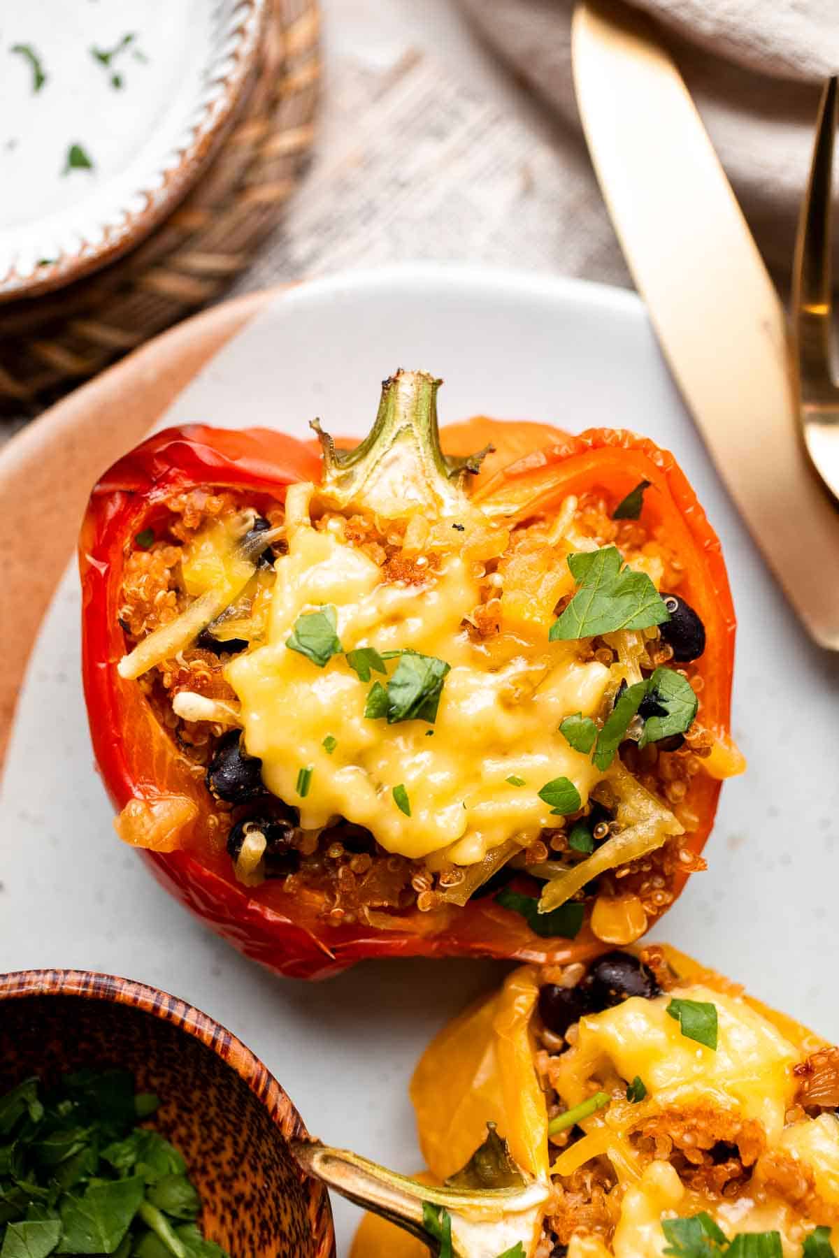 Close-up of a vegetarian quinoa stuffed pepper filled with black beans and melted cheese