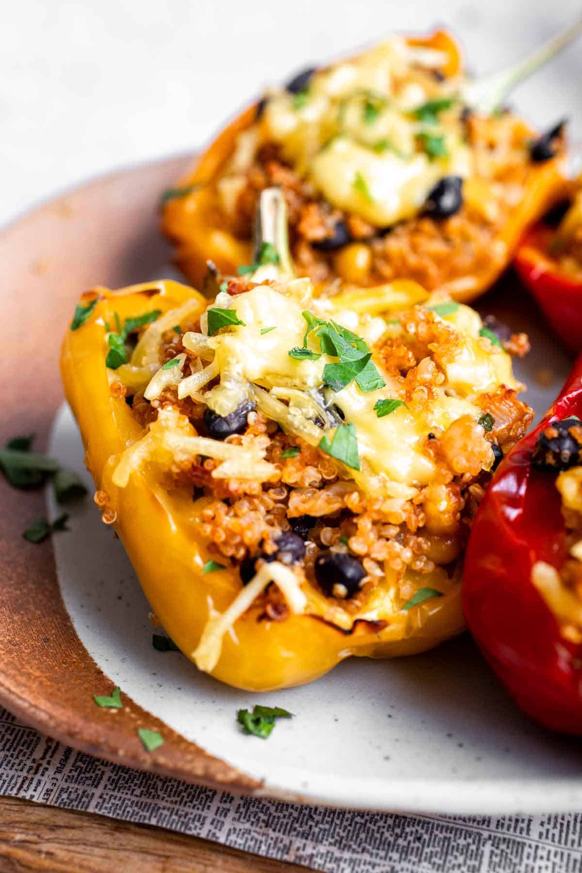 Close-up of a vegetarian quinoa stuffed pepper filled with black beans and melted cheese