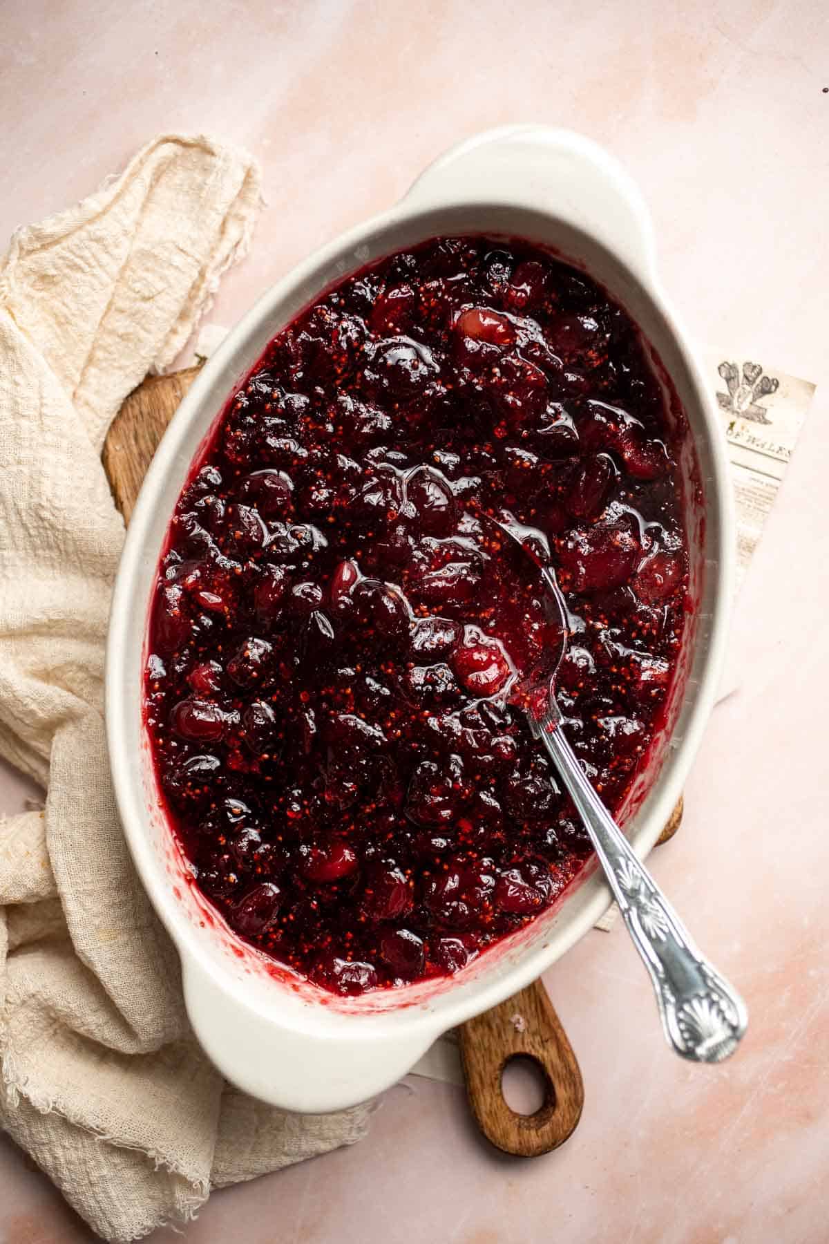 This Baked Cranberry Sauce recipe is an easy way to make a classic Thanksgiving side dish in the oven using 4 ingredients. It is thick, tart, and sweet. | aheadofthyme.com