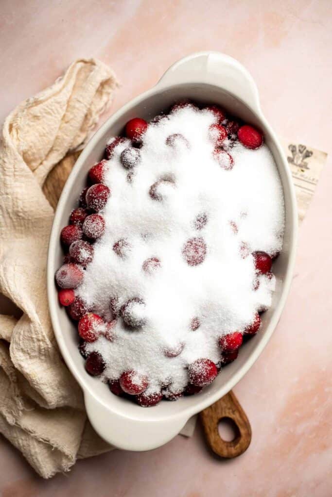 This Baked Cranberry Sauce recipe is an easy way to make a classic Thanksgiving side dish in the oven using 4 ingredients. It is thick, tart, and sweet. | aheadofthyme.com