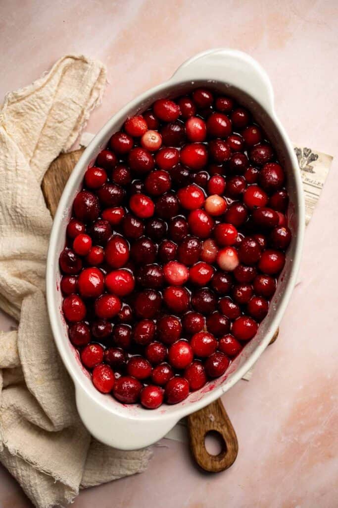 This Baked Cranberry Sauce recipe is an easy way to make a classic Thanksgiving side dish in the oven using 4 ingredients. It is thick, tart, and sweet. | aheadofthyme.com