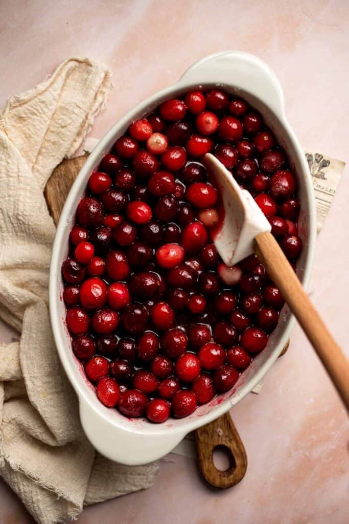 This Baked Cranberry Sauce recipe is an easy way to make a classic Thanksgiving side dish in the oven using 4 ingredients. It is thick, tart, and sweet. | aheadofthyme.com