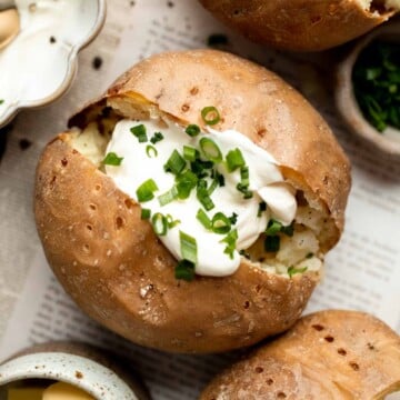 This Baked Potato is a delicious, hearty side dish that pairs well with any main course. It's fluffy and creamy inside, and golden brown and crispy outside. | aheadofthyme.com