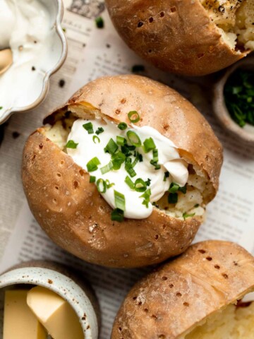 This Baked Potato is a delicious, hearty side dish that pairs well with any main course. It's fluffy and creamy inside, and golden brown and crispy outside. | aheadofthyme.com