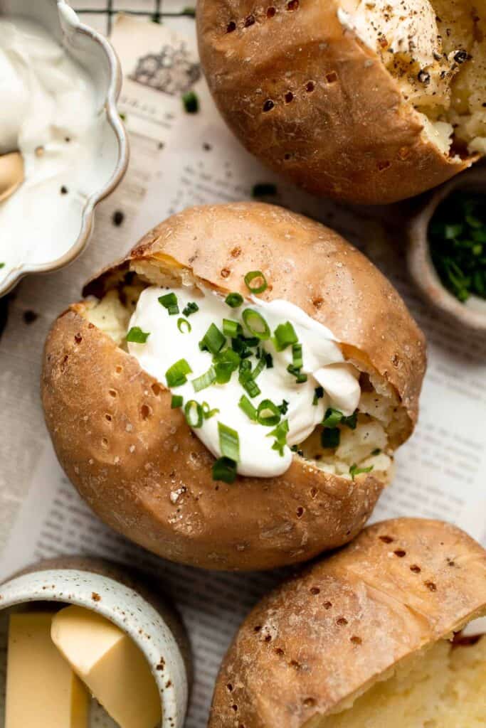 This Baked Potato is a delicious, hearty side dish that pairs well with any main course. It's fluffy and creamy inside, and golden brown and crispy outside. | aheadofthyme.com