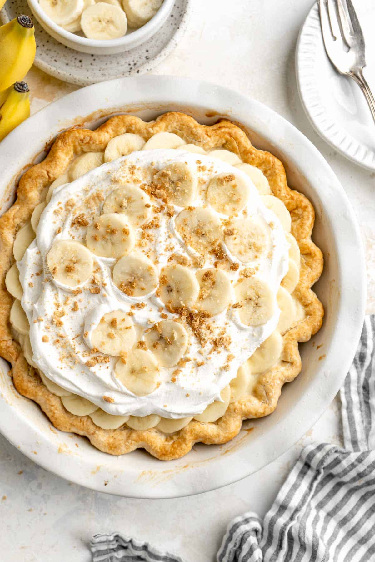 Homemade Banana Cream Pie is endlessly creamy with a buttery, flaky pie crust, a dreamy homemade vanilla custard, fresh banana slices, and whipped cream. | aheadofthyme.com