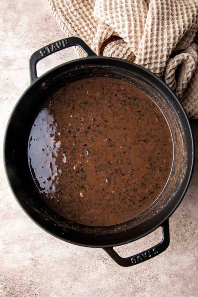 This Black Bean Soup is hearty, healthy, and cozy — everything you want in a soup! It's loaded with black beans, spices, and your favorite Mexican toppings. | aheadofthyme.com