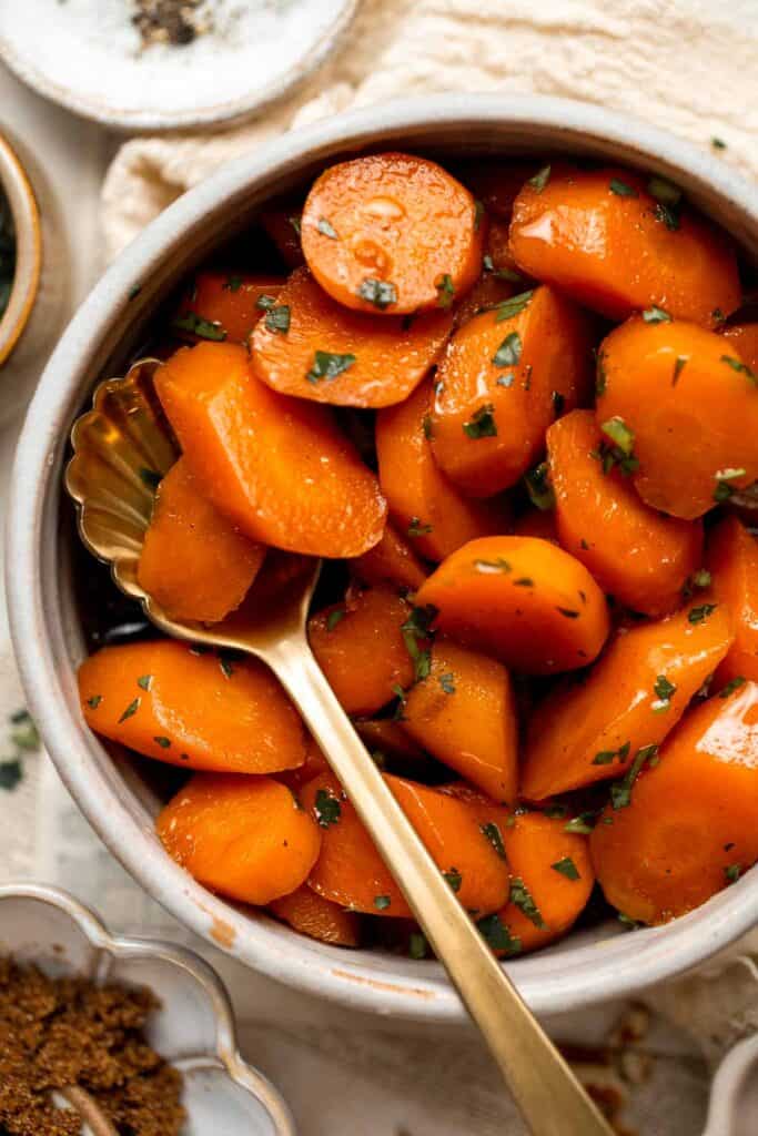 Candied Carrots are a delicious side dish that is sweetened with a simple brown sugar sauce before serving on your holiday table. It's so easy! | aheadofthyme.com