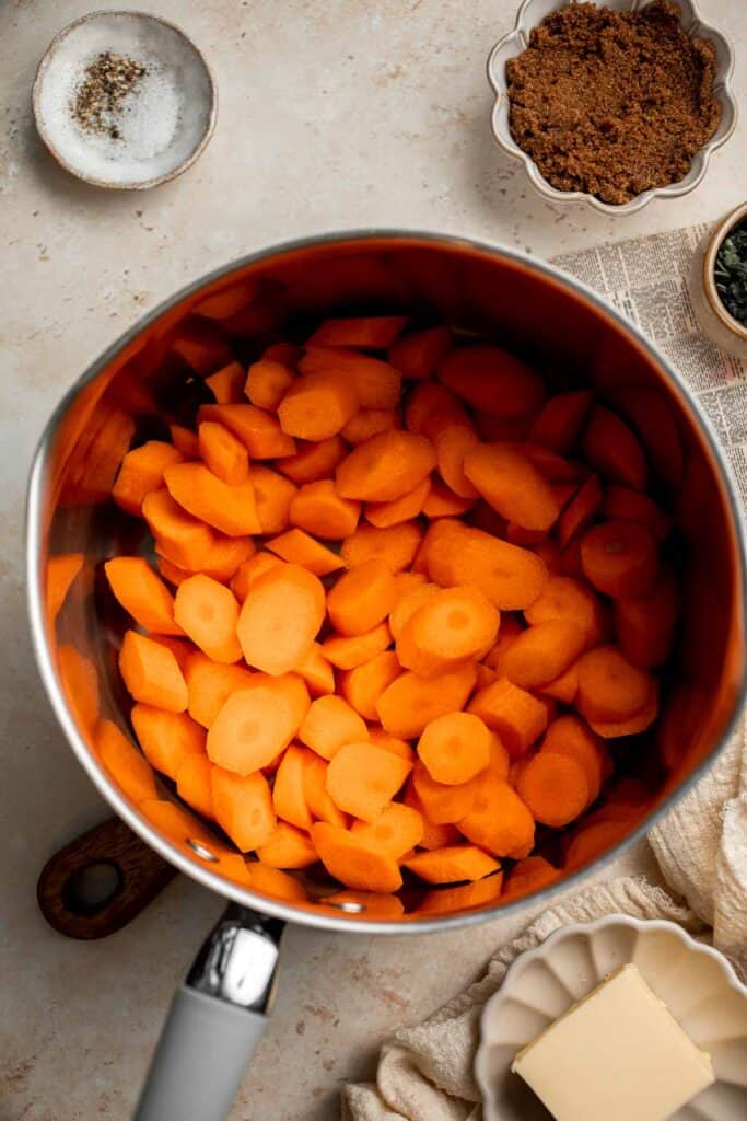 Candied Carrots are a delicious side dish that is sweetened with a simple brown sugar sauce before serving on your holiday table. It's so easy! | aheadofthyme.com