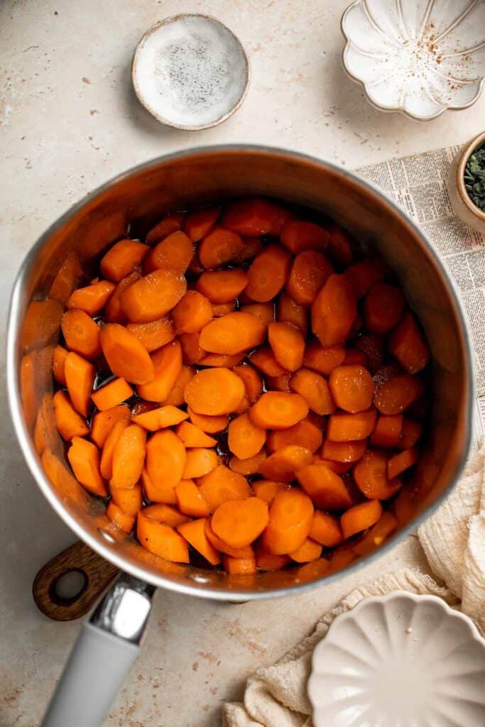 Candied Carrots are a delicious side dish that is sweetened with a simple brown sugar sauce before serving on your holiday table. It's so easy! | aheadofthyme.com