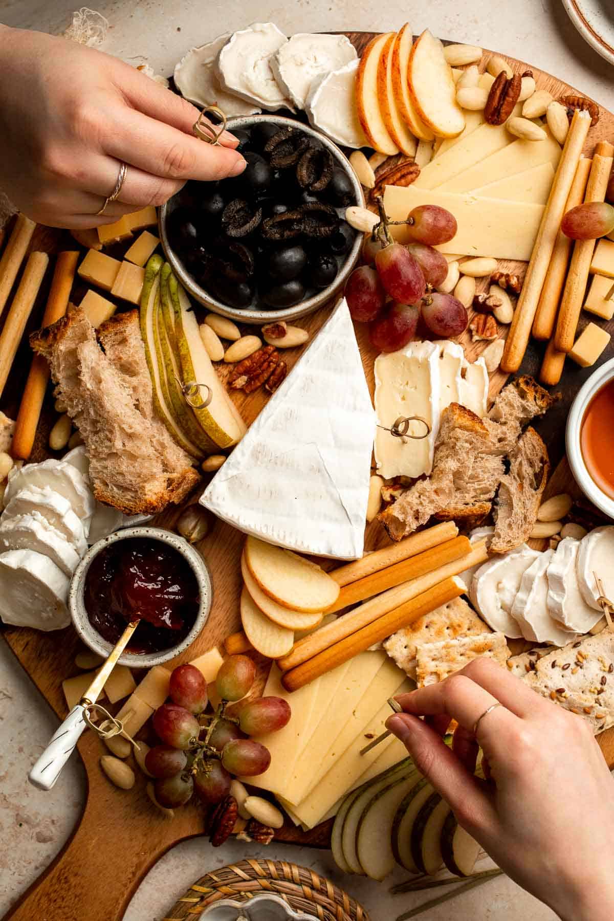 This easy Cheese Board is a popular and classic appetizer arranged with an assortment of cheese, bread and crackers, fresh fruit, and nuts. | aheadofthyme.com