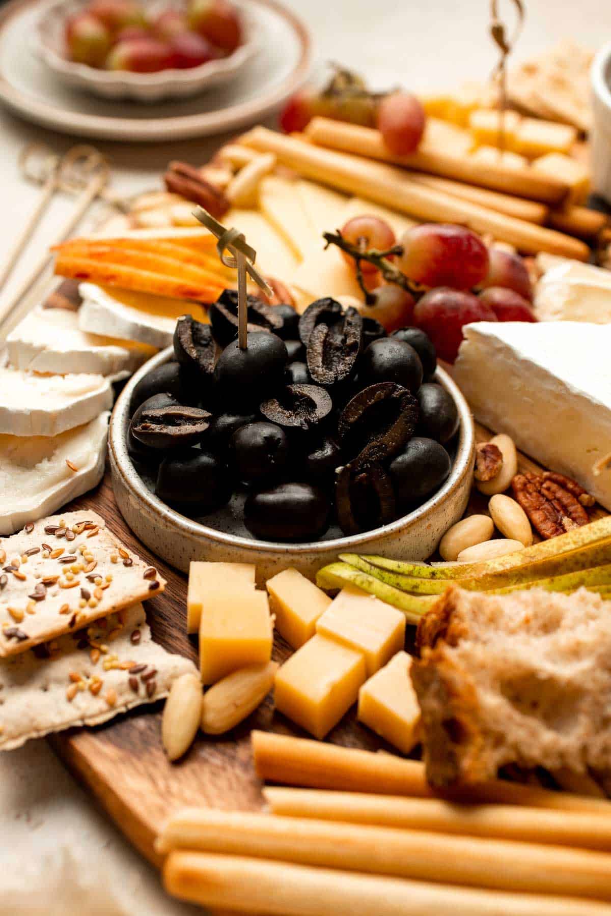 This easy Cheese Board is a popular and classic appetizer arranged with an assortment of cheese, bread and crackers, fresh fruit, and nuts. | aheadofthyme.com