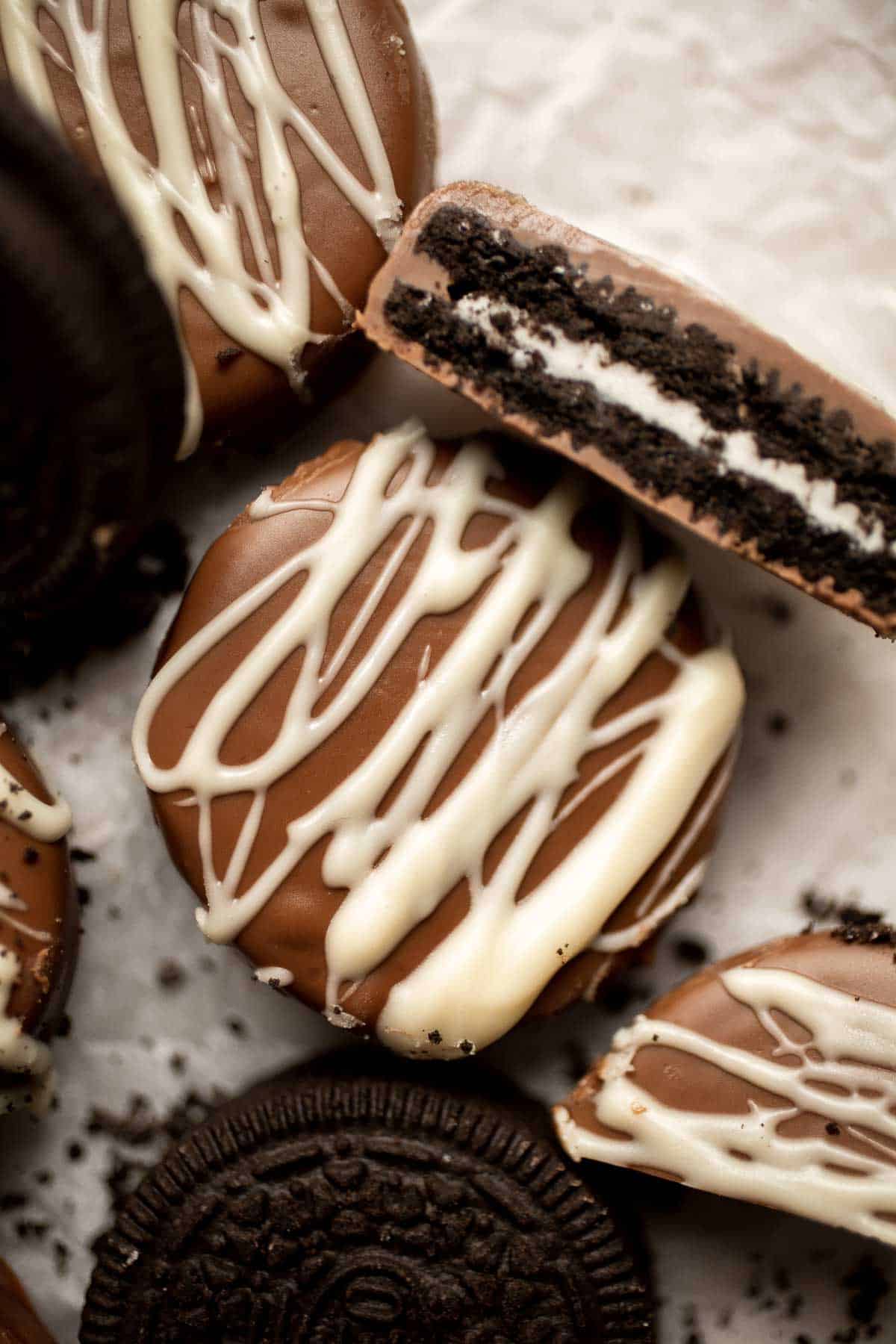 Chocolate Covered Oreos are a perfect last minute treat! Level up regular Oreos with a layer of semi-sweet chocolate and a white chocolate drizzle on top. | aheadofthyme.com