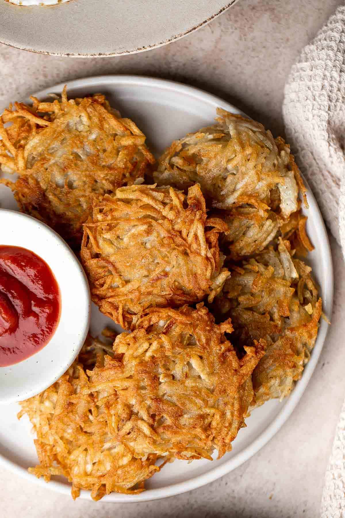 These crispy Hash Browns have a crisp, golden exterior and are soft inside — the defining features of a good hash brown. Make in just 20 minutes! | aheadofthyme.com