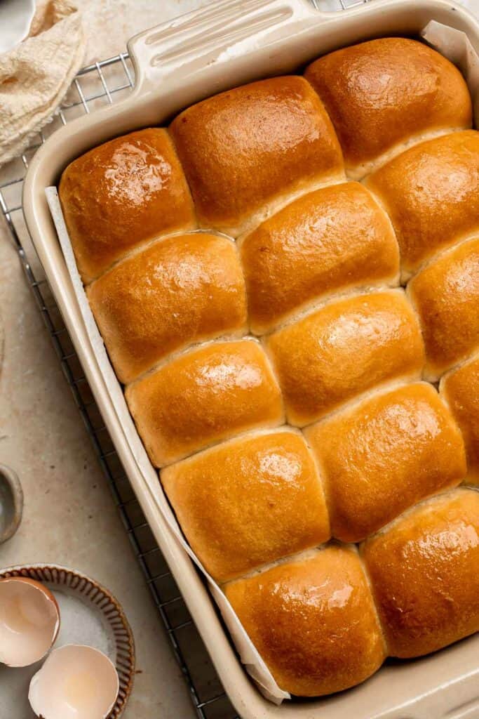 Notoriously light and fluffy with a little fold in the middle, these Parker House Rolls are the perfect dinner roll. They're buttery and incredibly tender. | aheadofthyme.com
