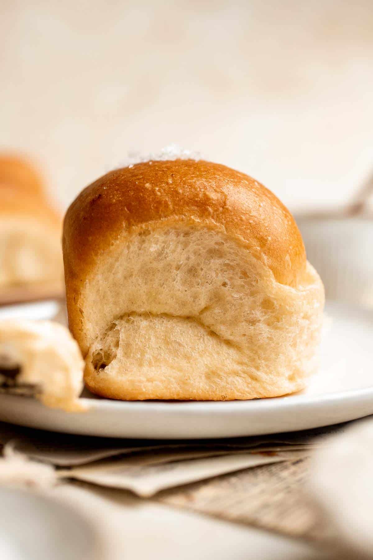 Notoriously light and fluffy with a little fold in the middle, these Parker House Rolls are the perfect dinner roll. They're buttery and incredibly tender. | aheadofthyme.com