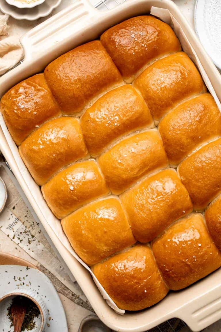 Notoriously light and fluffy with a little fold in the middle, these Parker House Rolls are the perfect dinner roll. They're buttery and incredibly tender. | aheadofthyme.com